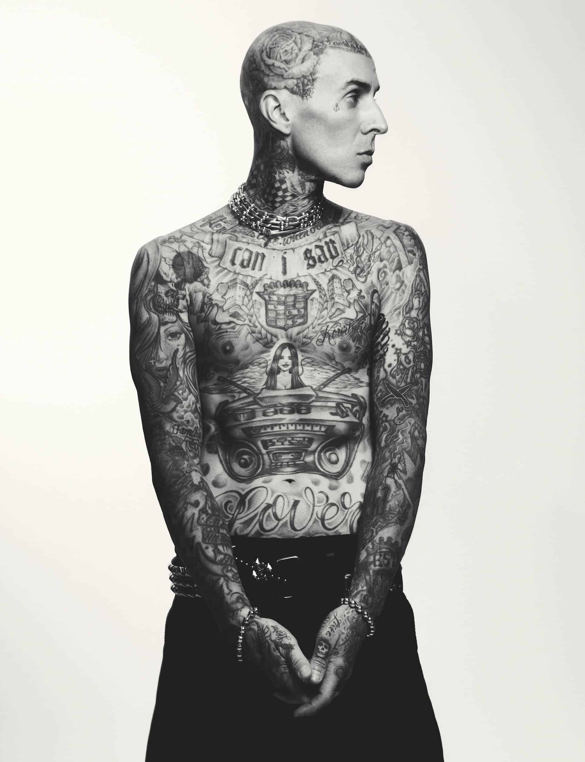Travis Barker tattooed profile and torso