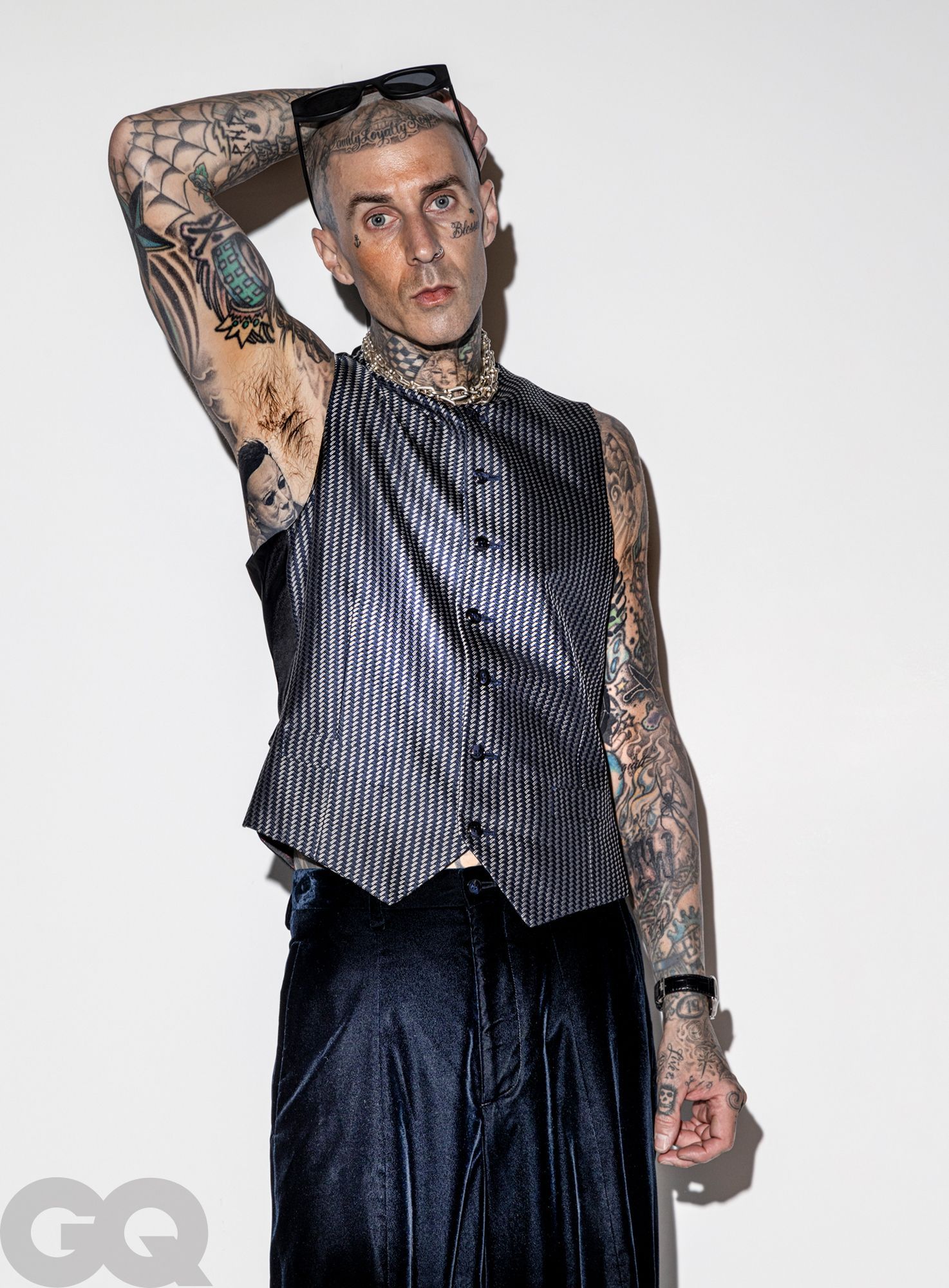 Travis Barker’s tattooed upper body in a GQ portrait