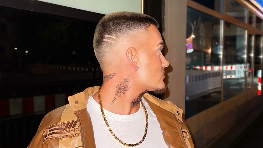Twenty4Tim rose tattoo on his neck