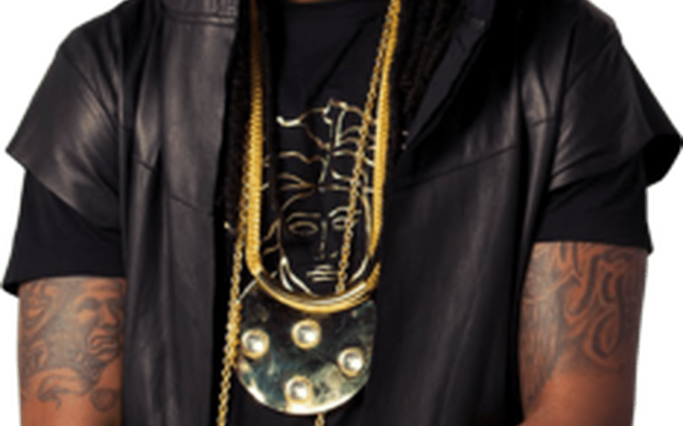 Two Chainz tattooed arms and gold chains