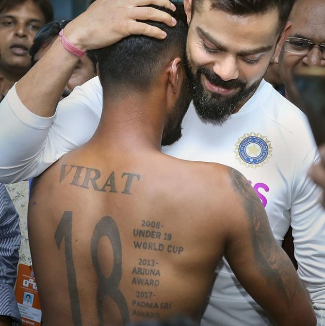 Virat Kohli back achievement tattoo