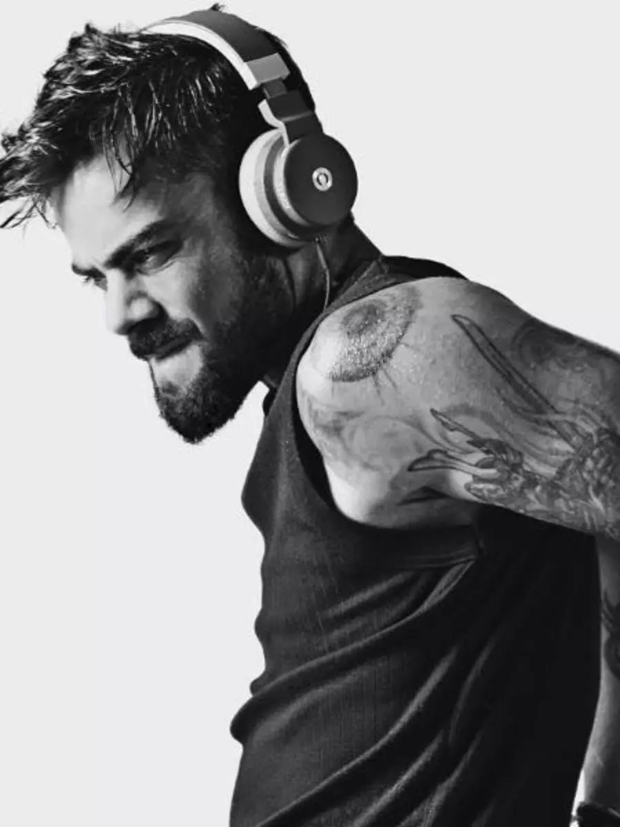 Virat Kohli inked arm portrait