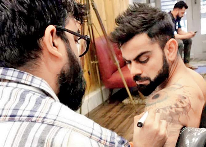 Virat Kohli family name tattoos
