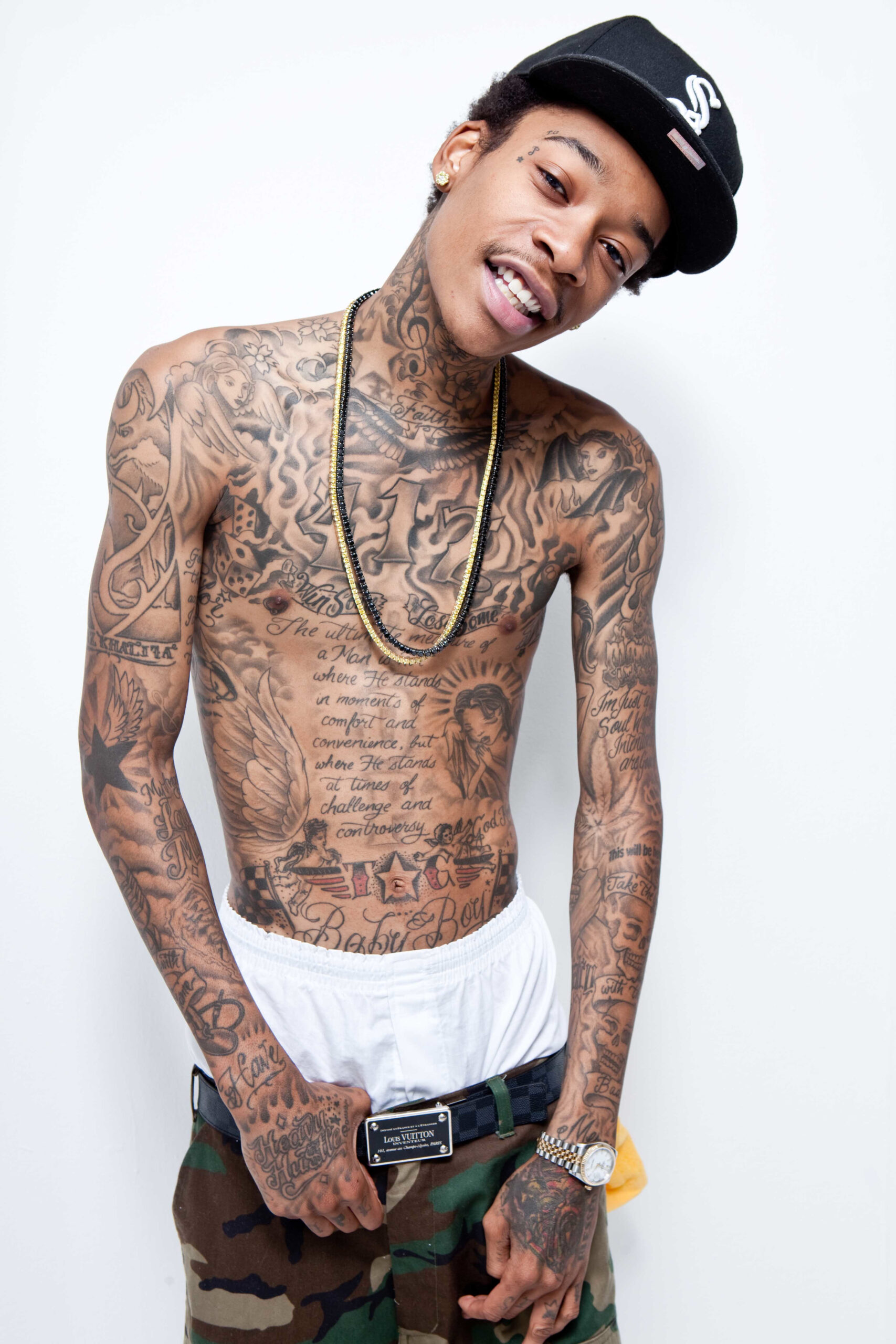 Wiz Khalifa chest and arms tattoos
