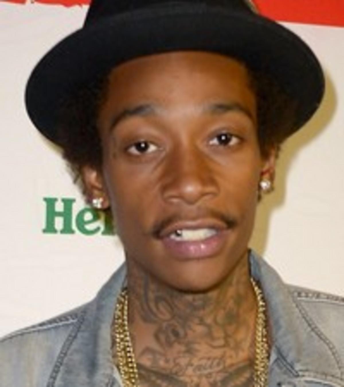 Wiz Khalifa neck lettering tattoos