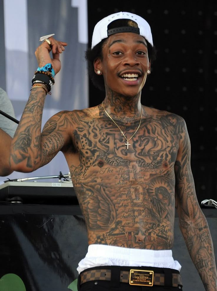 Wiz Khalifa stage lettering tattoos