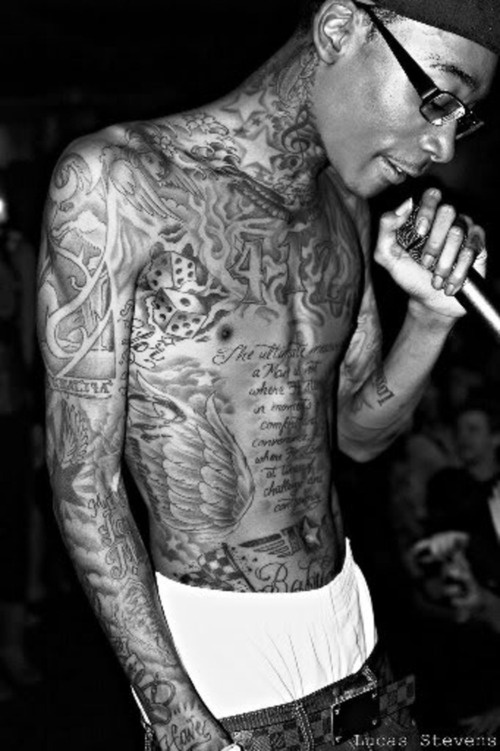 Wiz Khalifa wings and dice tattoos