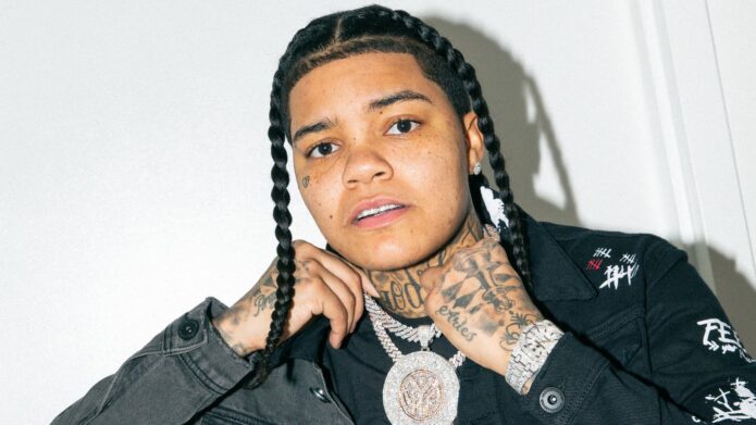Young M.A hand and neck tattoos