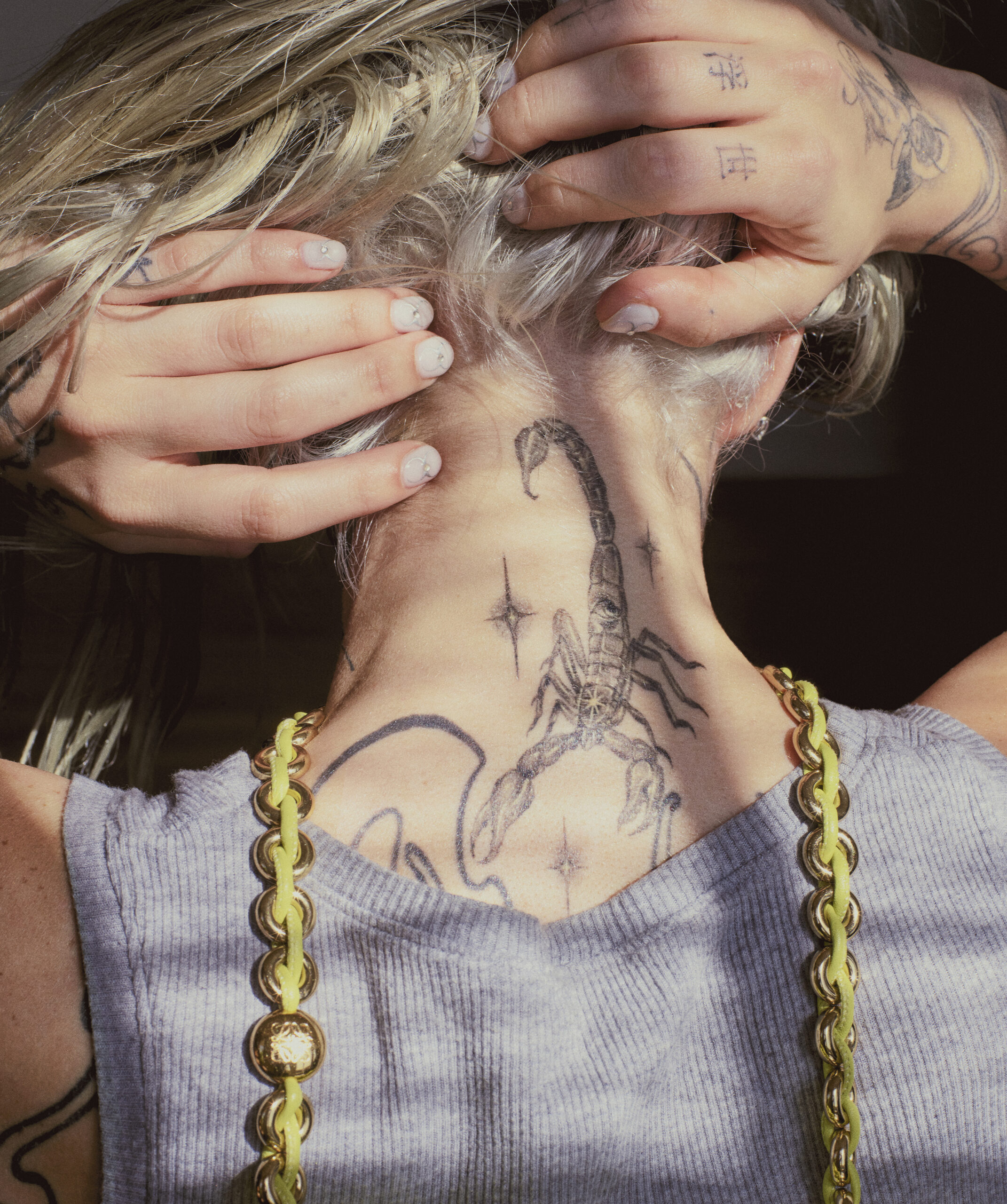 Young Miko scorpion neck tattoo