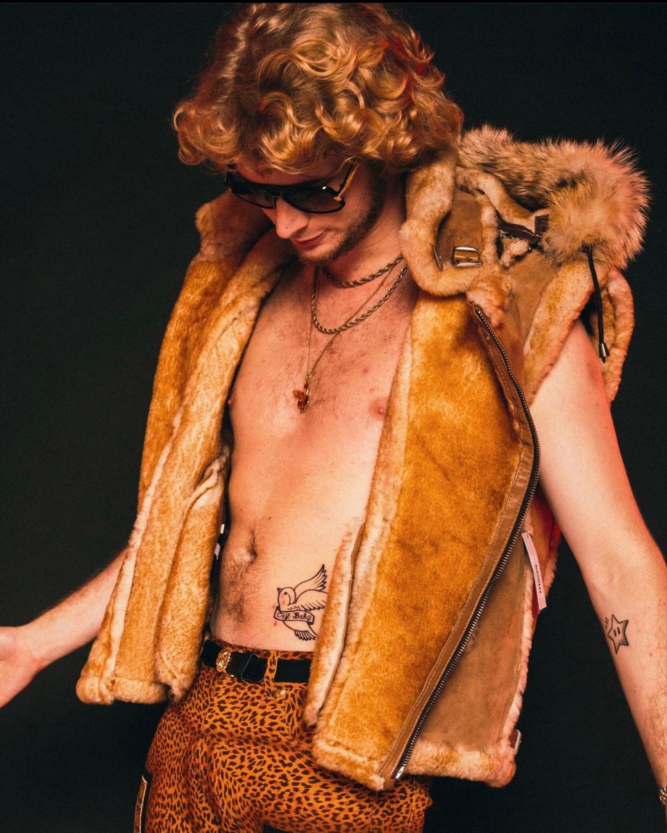 Yung Gravy dove and Cry Baby tattoo on the abdomen