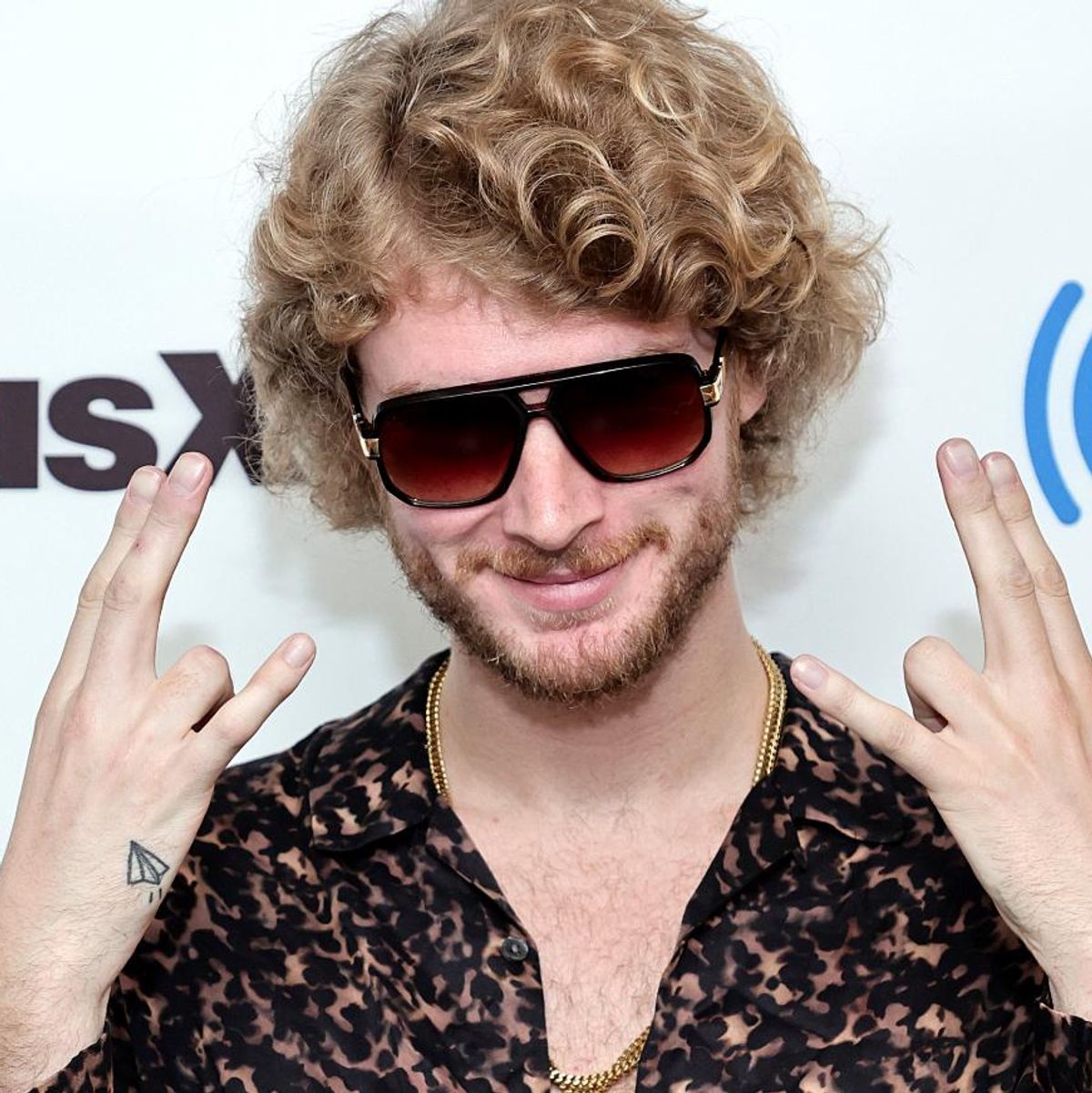 Yung Gravy paper airplane tattoo on the wrist