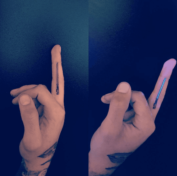 Zayn Malik UV lightsaber tattoo on his middle finger
