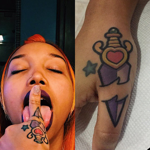 Zonnique Pullins dagger hand tattoo