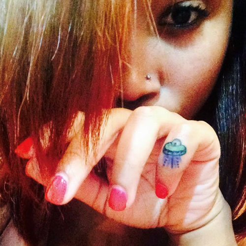 Zonnique Pullins spaceship knuckle tattoo