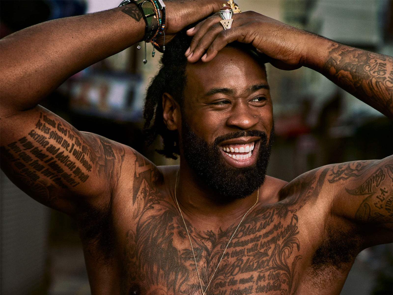 DeAndre Jordan tattoos: chest and arm tattoo coverage