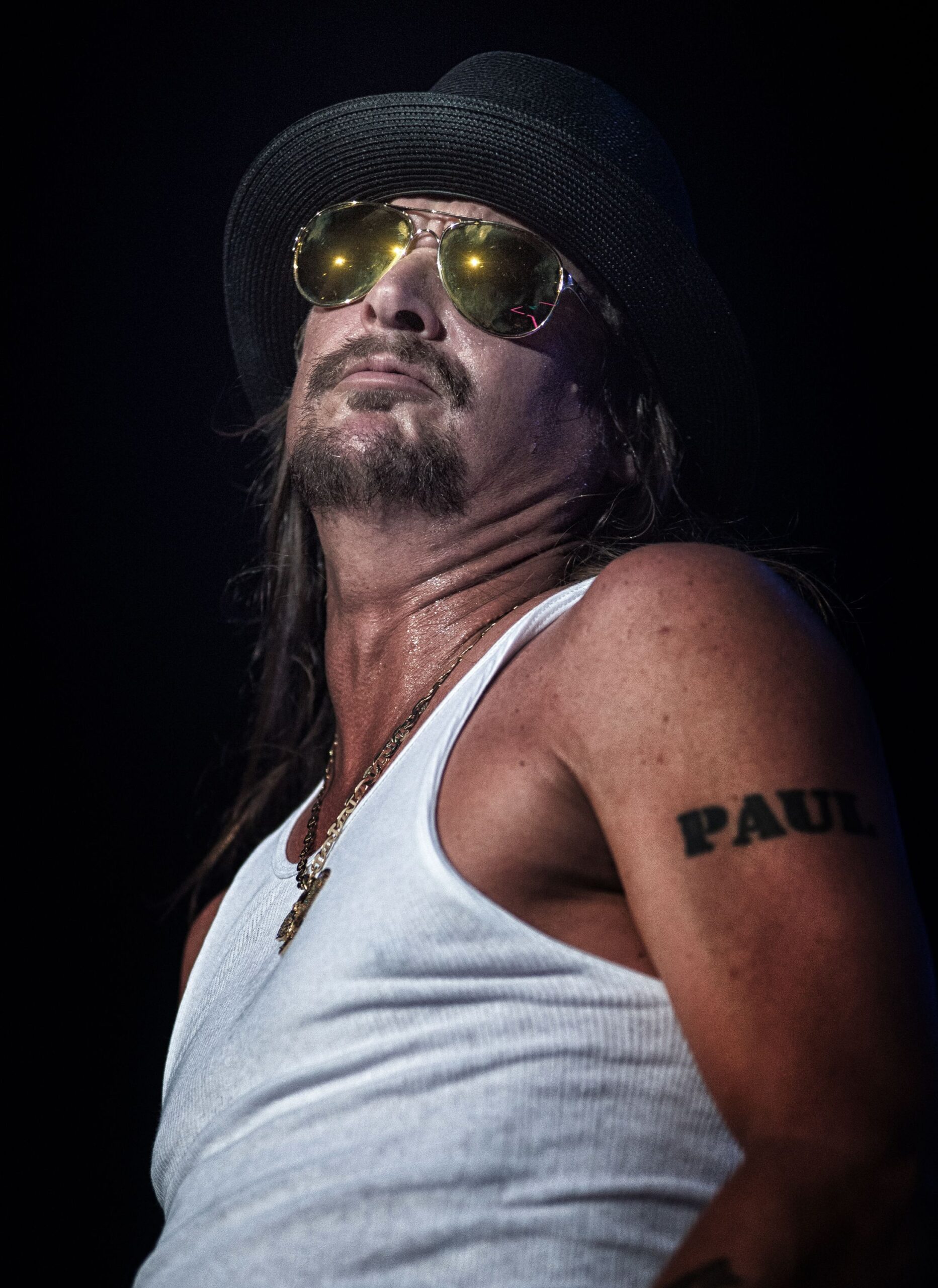 Kid Rock tattoos: upper-arm lettering