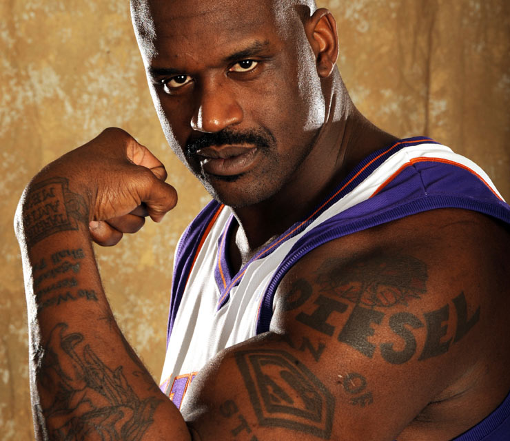 Shaquille O'Neal tattoos: Diesel lettering and upper-arm scale