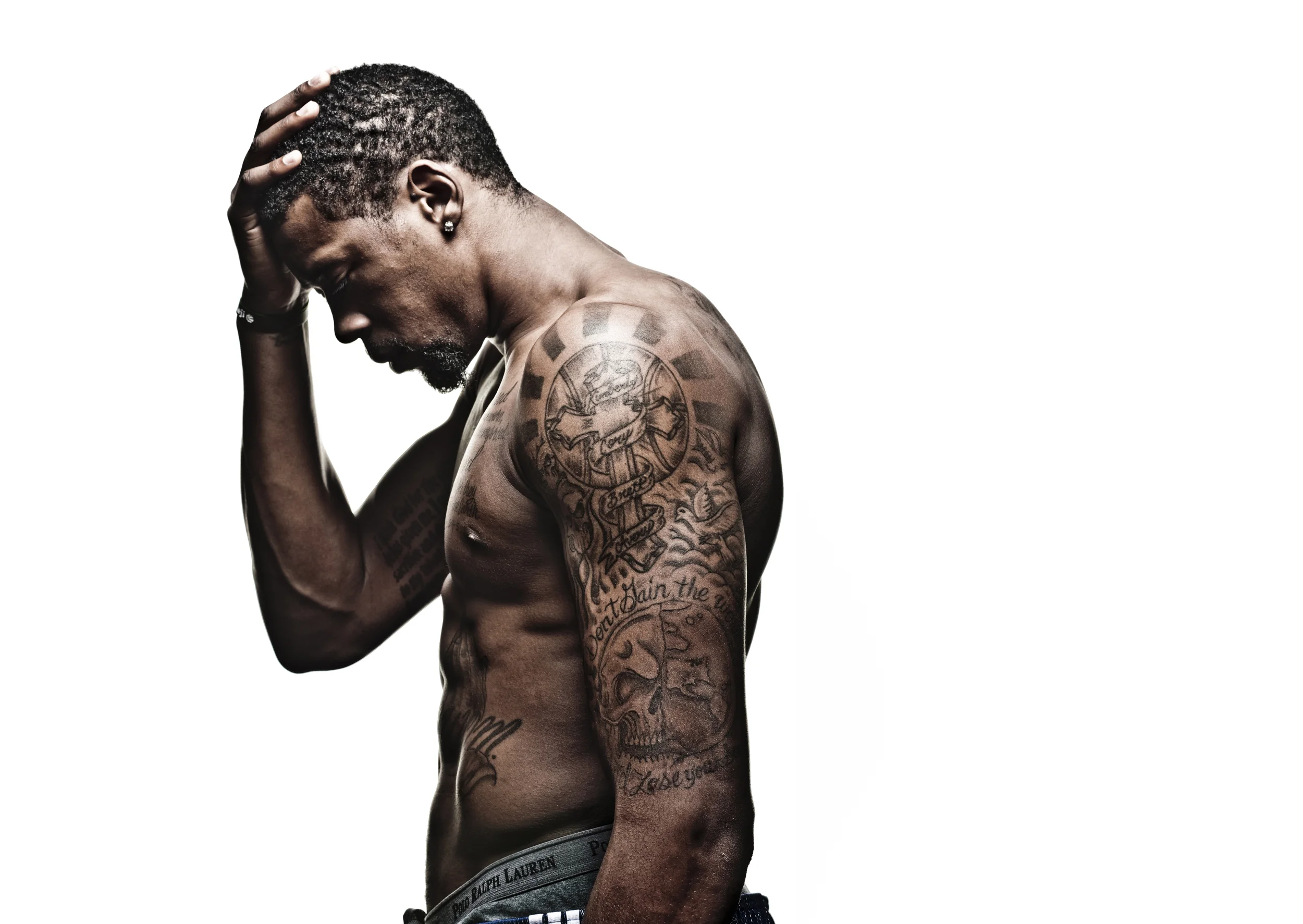 DeAndre Jordan tattoos: shoulder and upper-arm tattoo placement