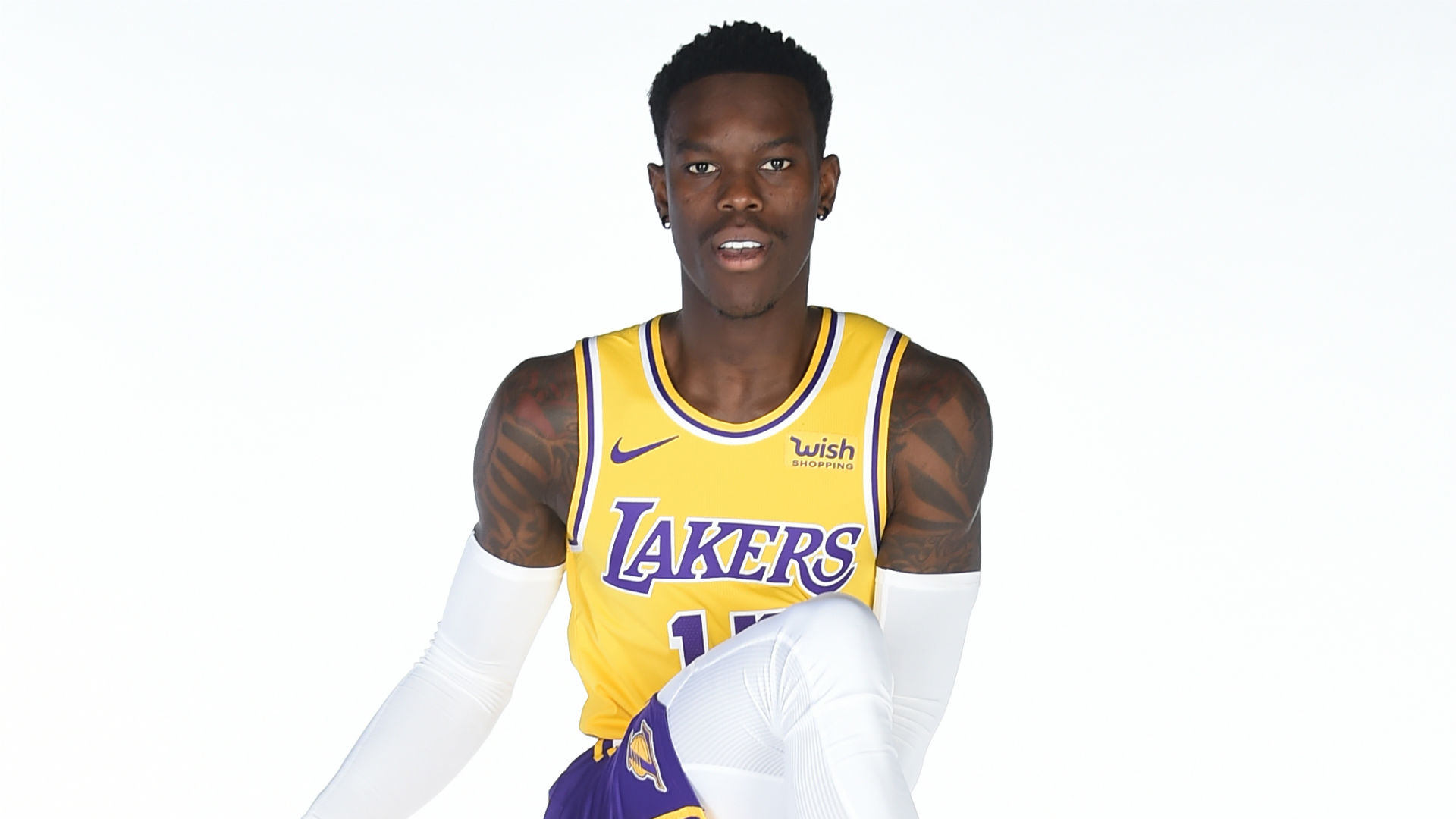 Dennis Schröder tattoos: arm symbols and lettering