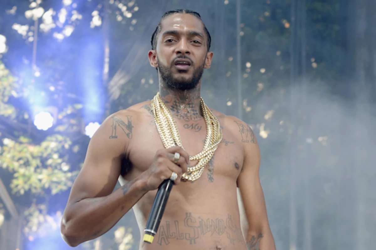 Nipsey Hussle tattoos: chest and stomach tattoo scale
