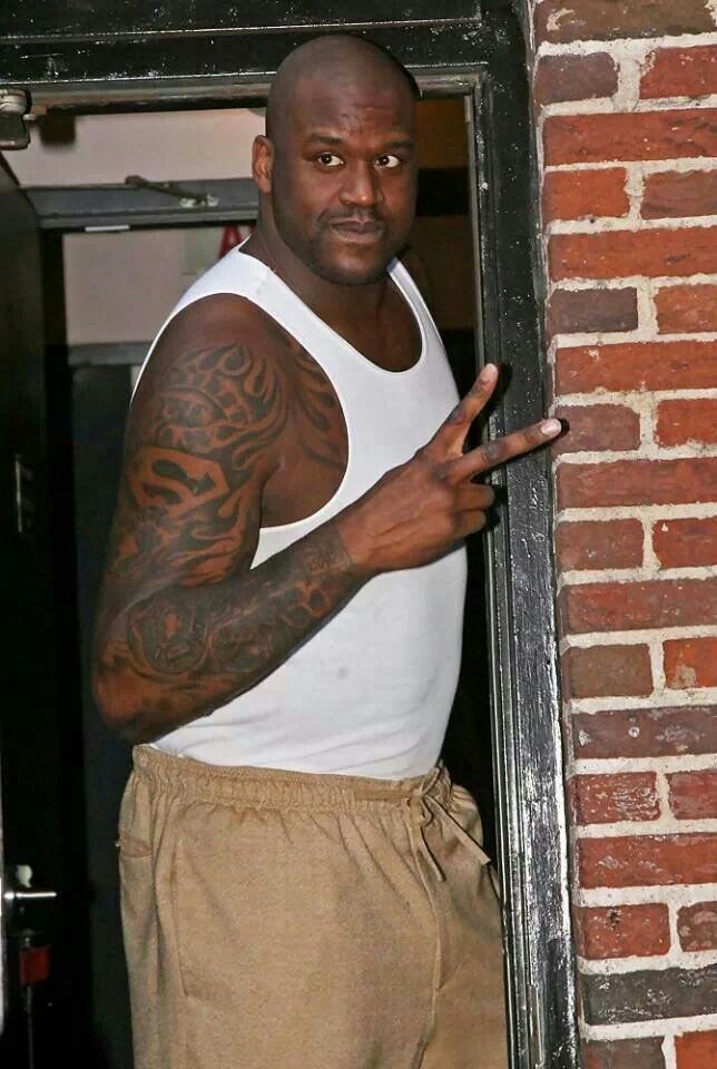 Shaquille O'Neal tattoos: Superman imagery and symbol placement