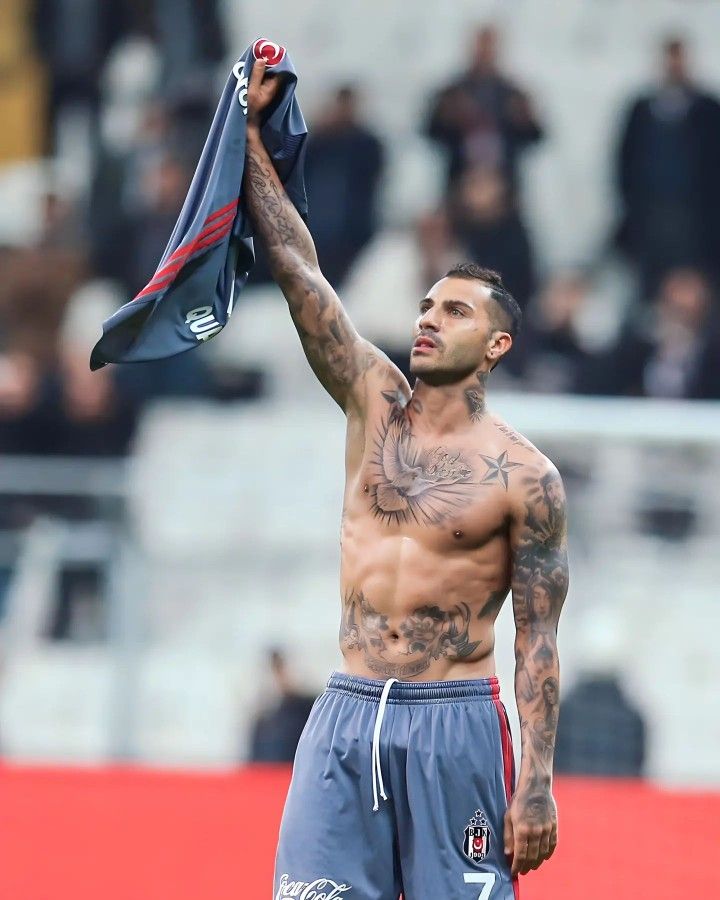 Ricardo Quaresma showing his eagle chest tattoo