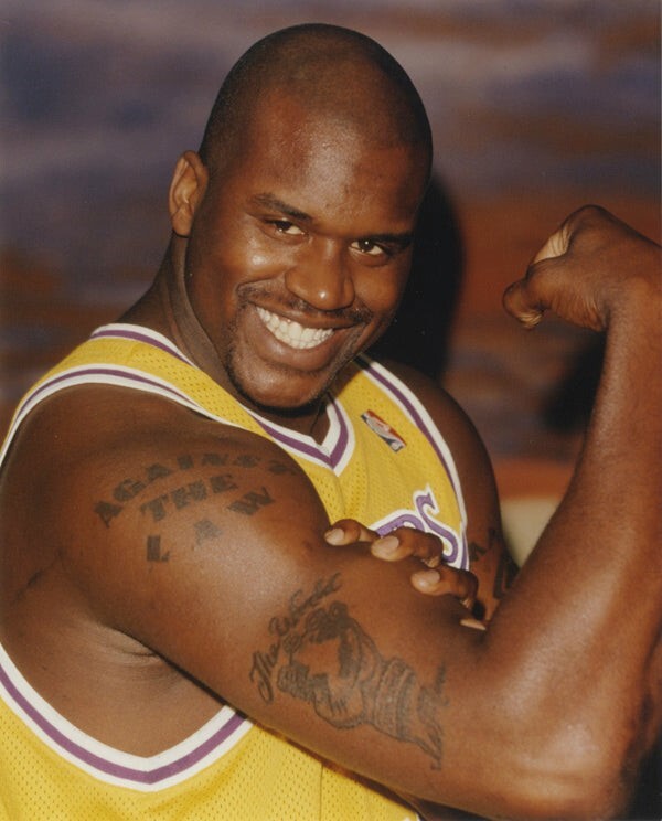 Shaquille O'Neal tattoos: forearm lettering and compact images