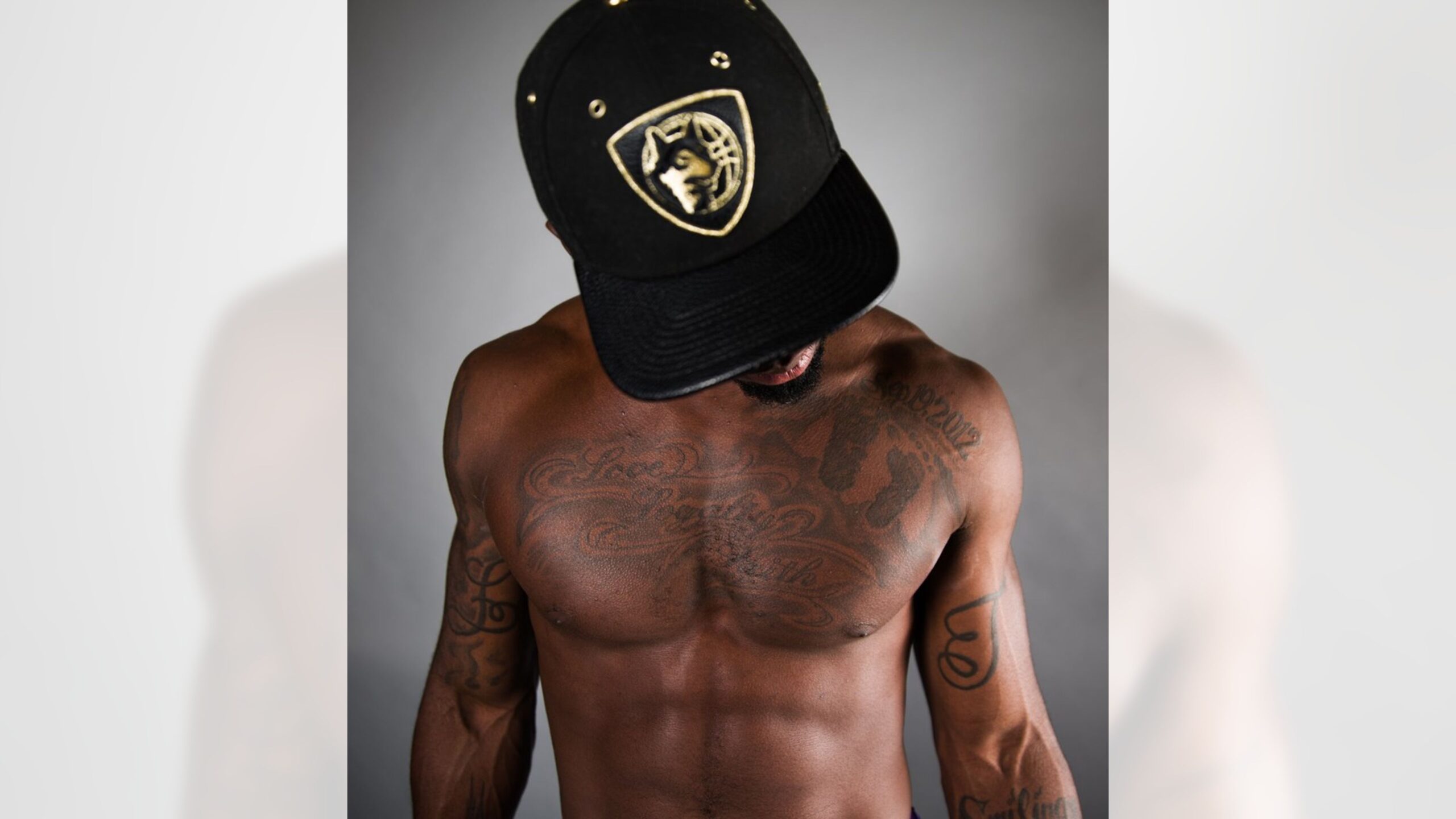Laquon Treadwell upper-arm linework tattoo portrait Laquon Treadwell tattoos: color portrait showing upper-arm linework and chest tattoos