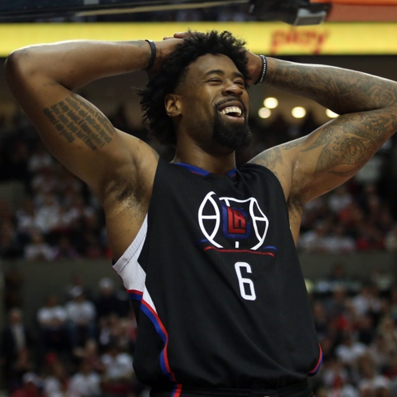 DeAndre Jordan tattoos: Serenity Prayer lettering and readable arm placement