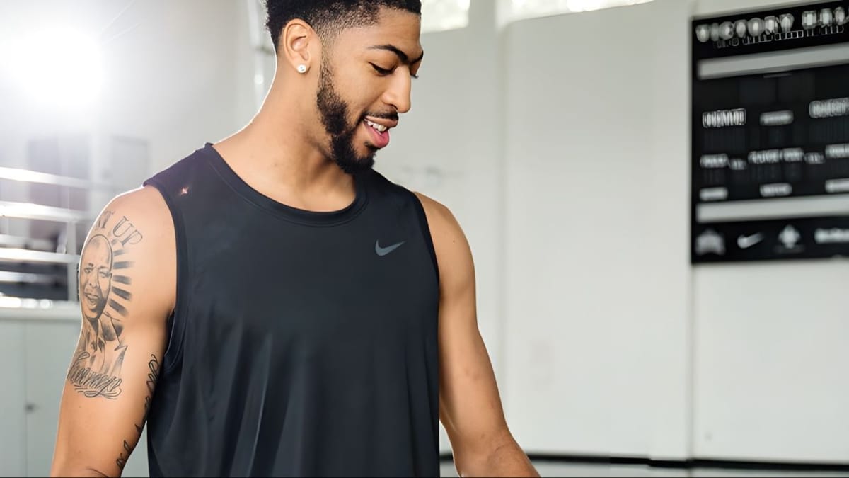 Anthony Davis tattoos: upper-arm portrait and sleeve planning
