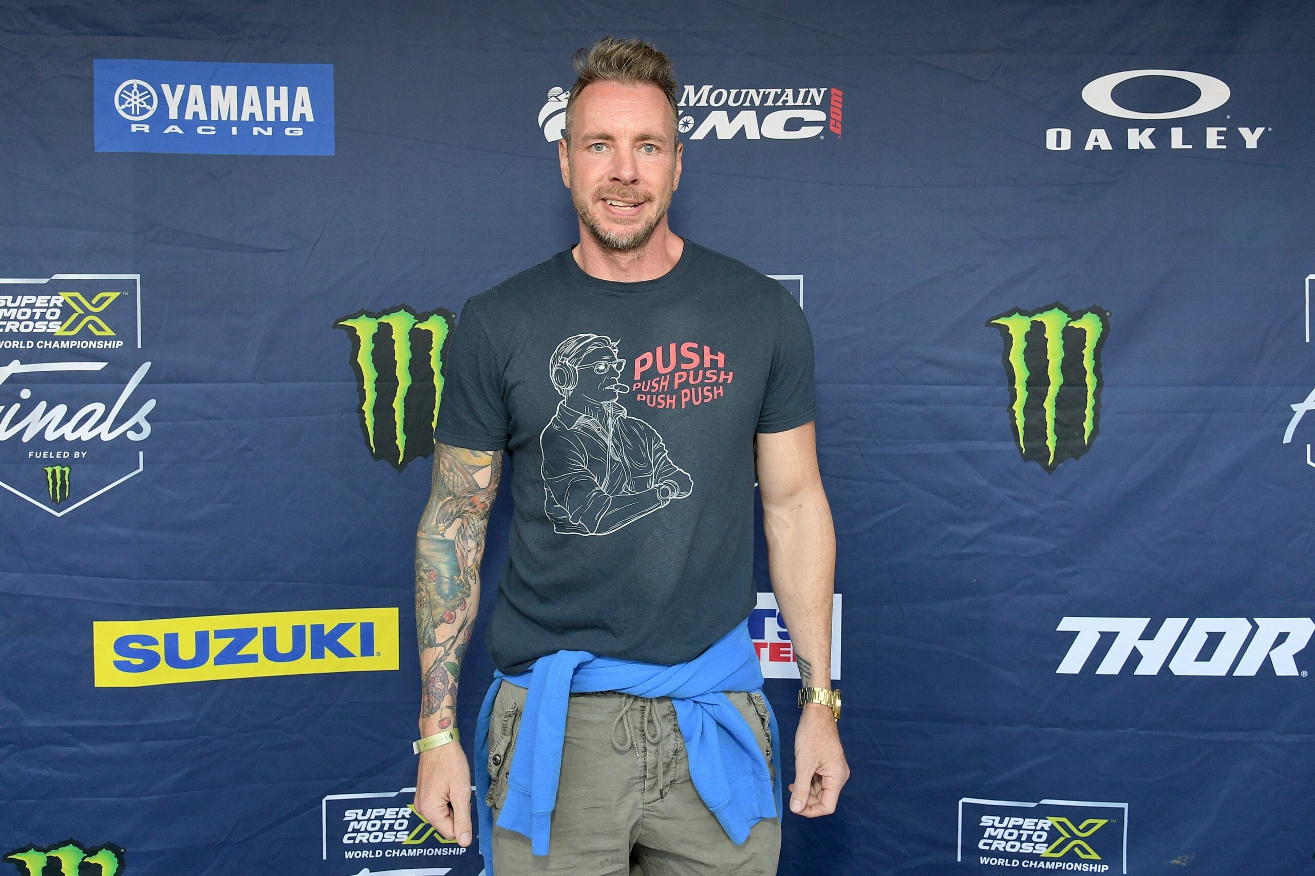 Dax Shepard tattoos: high-resolution photograph showing the colorful full right-arm tattoo sleeve