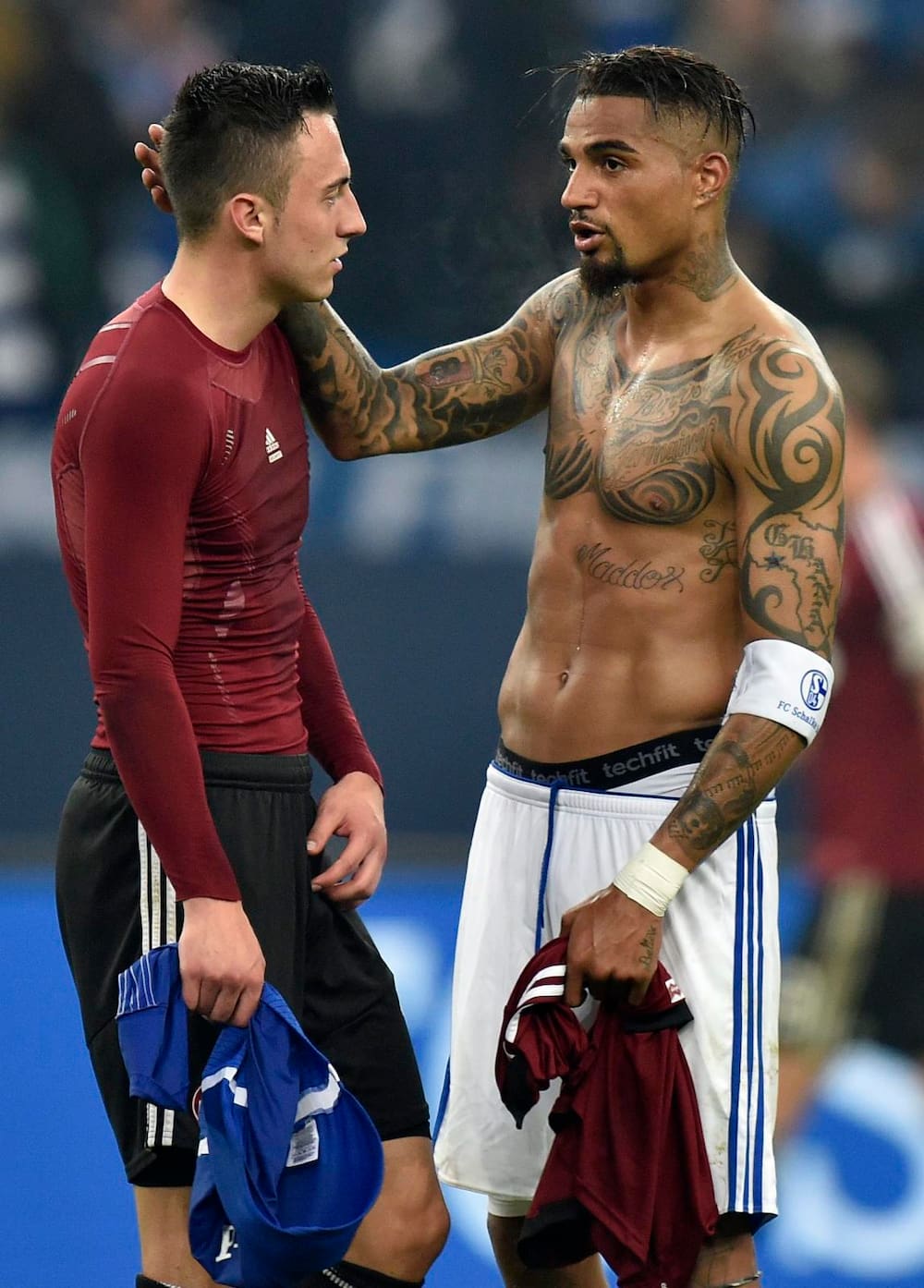 Kevin-Prince Boateng tattoos: shirtless match photograph with visible neck, arm and torso tattoos