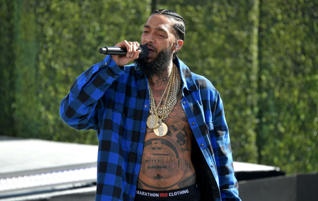 Nipsey Hussle tattoos: torso tattoos as seen through clothing