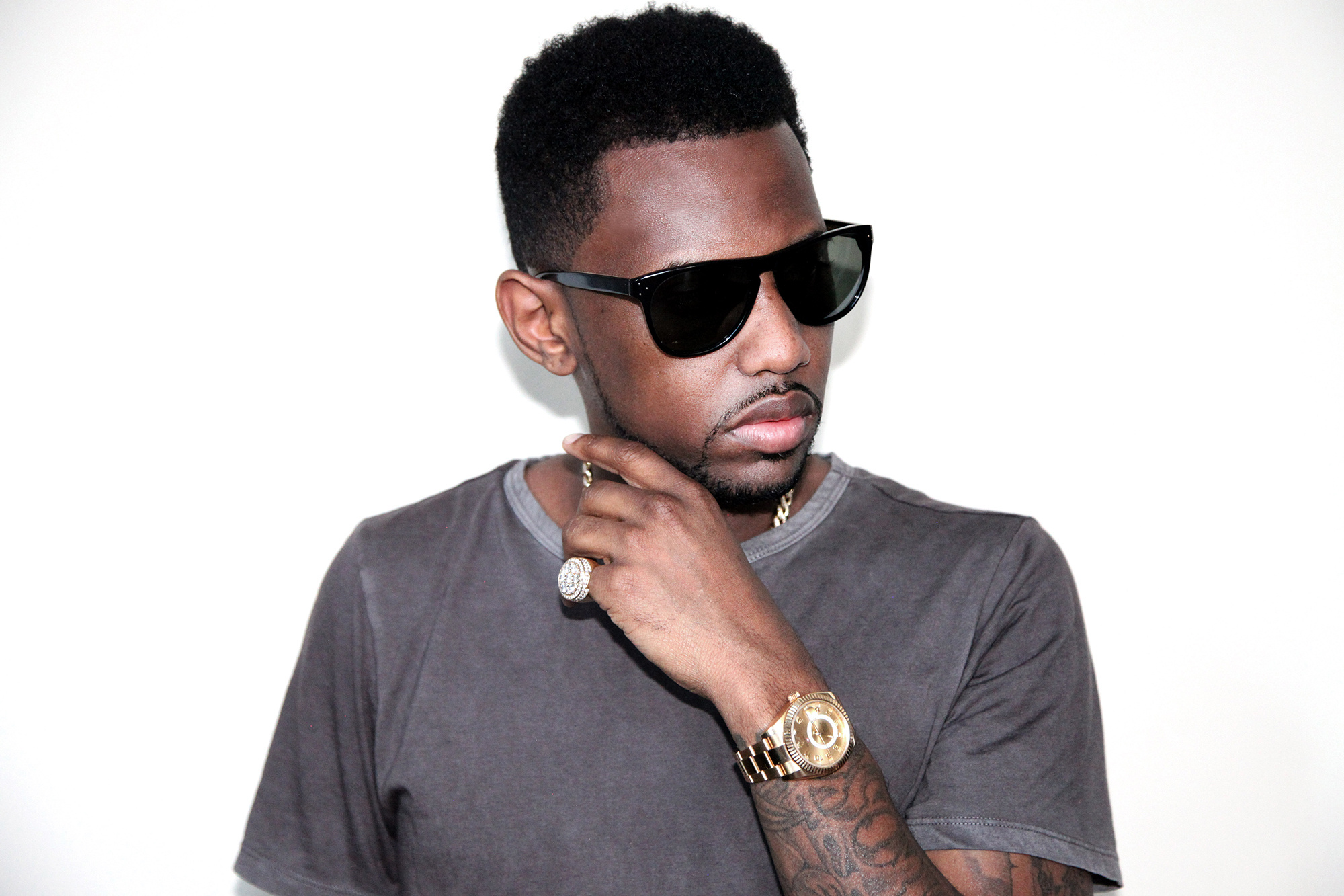 Fabolous tattoos: high-resolution portrait showing the tattooed forearm and black-and-gray shading