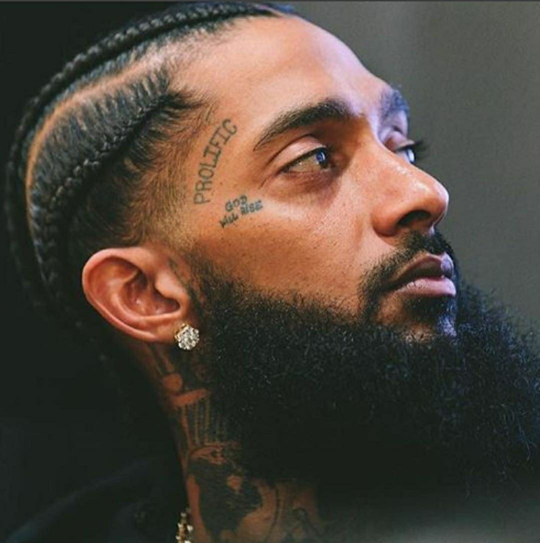 Nipsey Hussle tattoos: face tattoo placement and lettering
