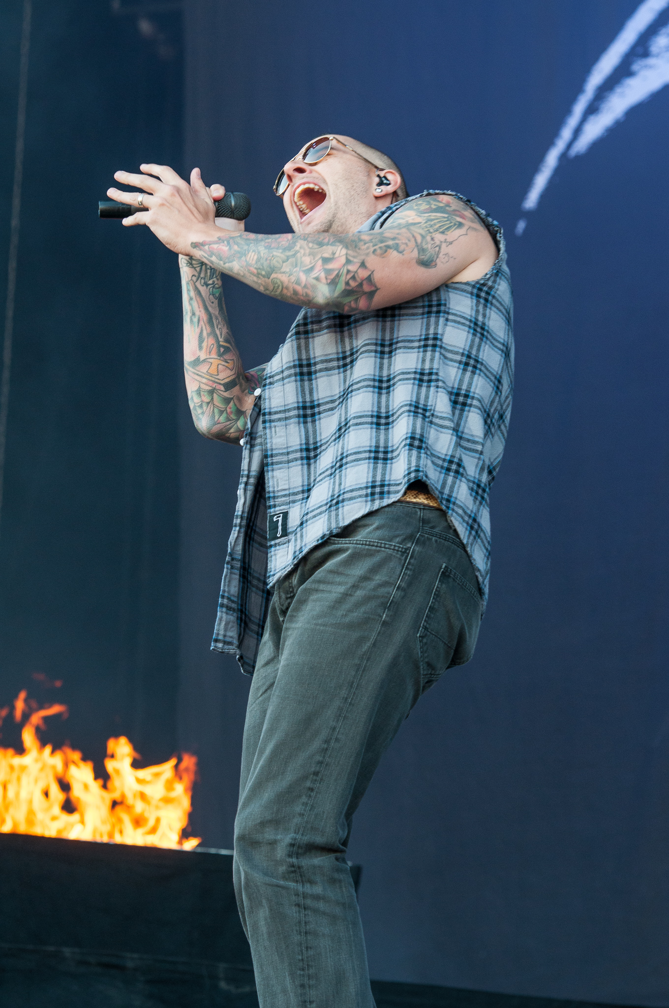 M. Shadows with colorful tattoo sleeves visible
