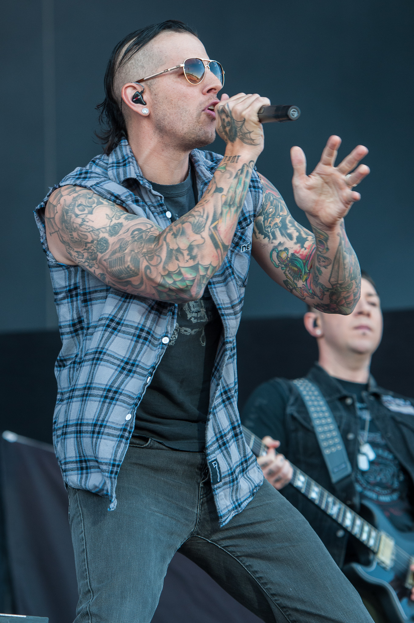 Close view of M. Shadows' colorful arm tattoos