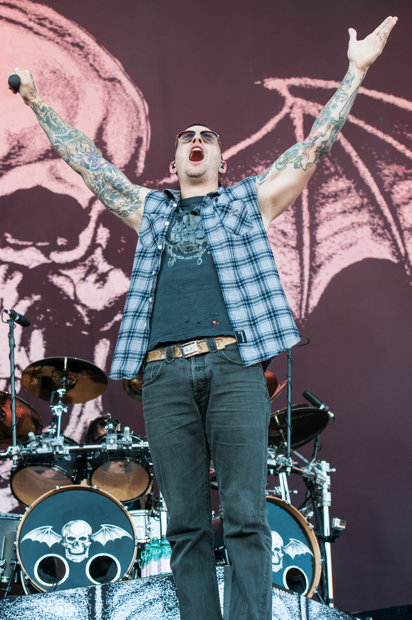 M. Shadows with chest and arm tattoos visible