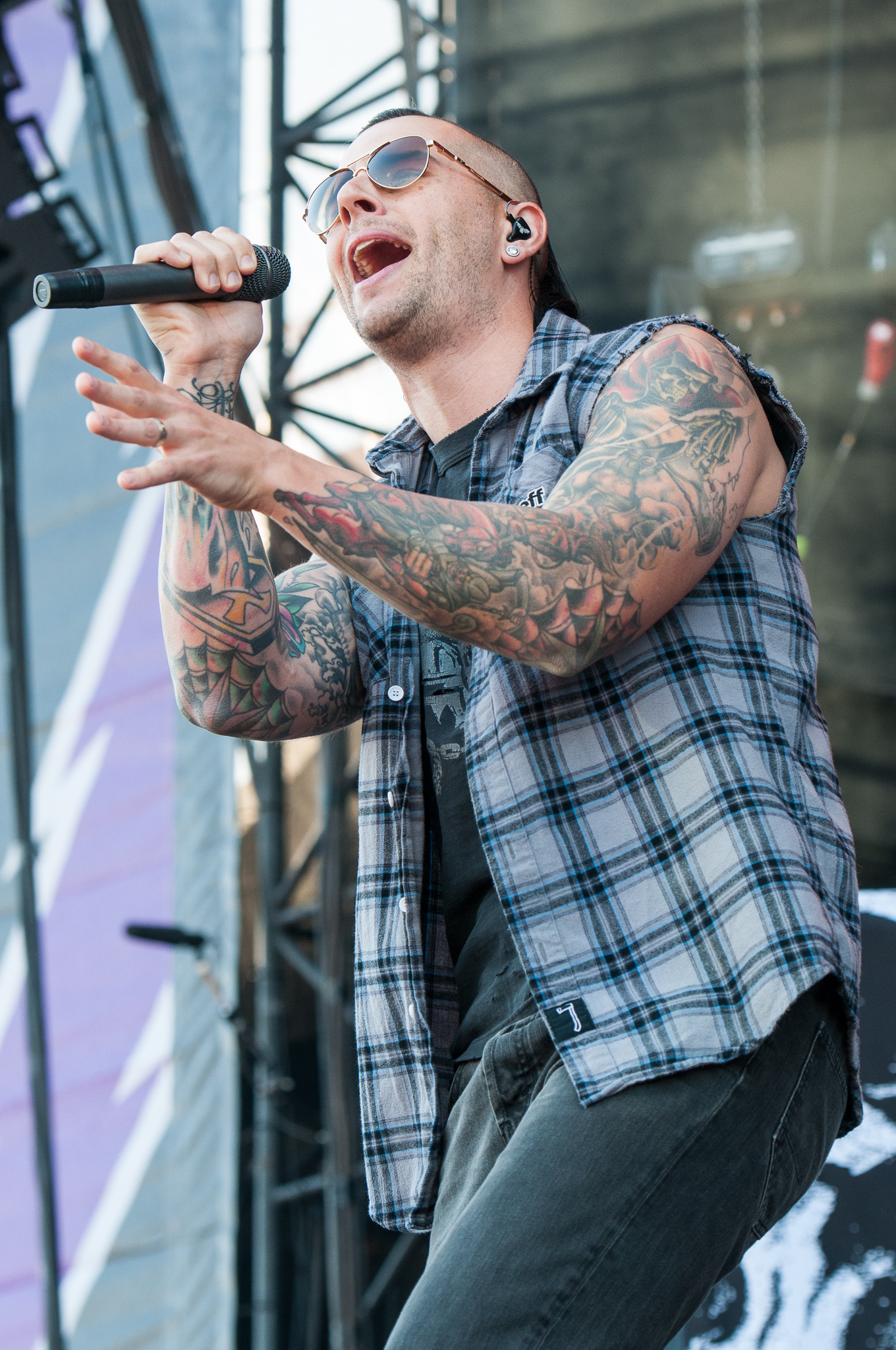 M. Shadows with hand and forearm tattoos visible while performing