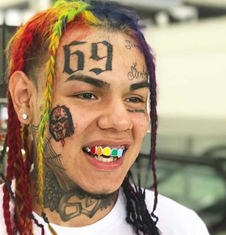 6ix9ine Jigsaw cheek tattoo