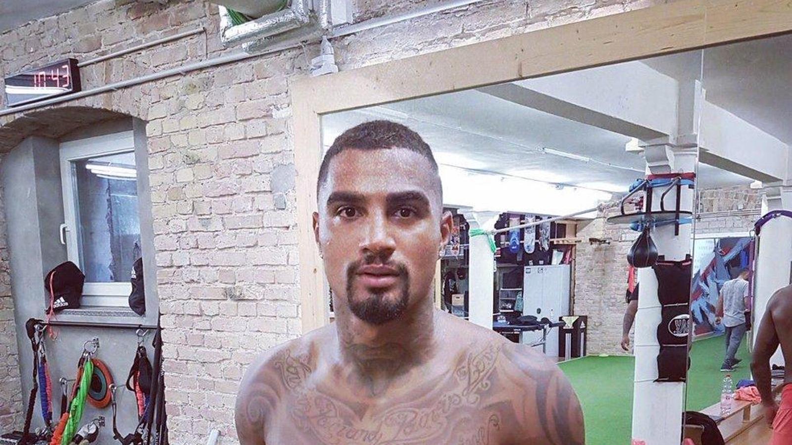 Kevin-Prince Boateng tattoos: gym portrait focused on the arm and shoulder tattoo groups