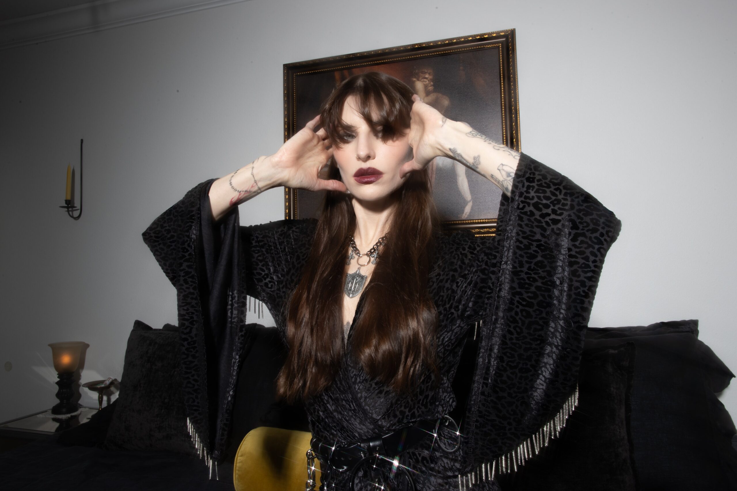 Lilith Czar tattoos: high-resolution color portrait with visible tattoos across the hands, wrists and forearms