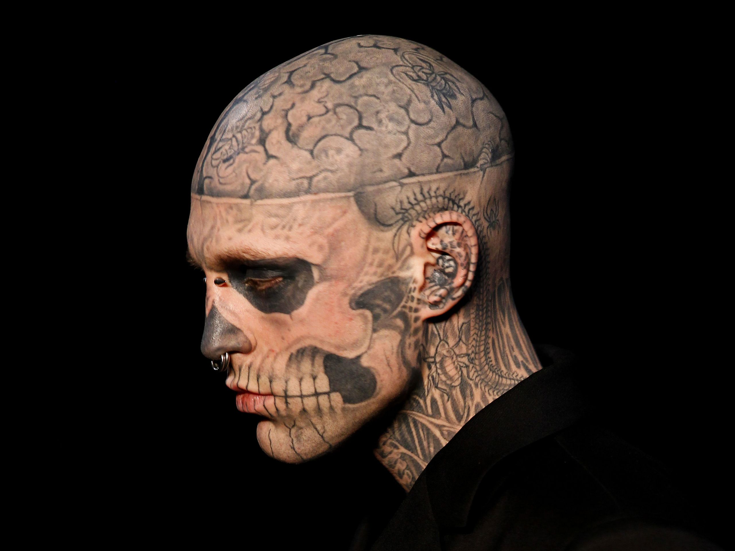 Rick Genest tattoos: large studio close-up showing the brain, temple, ear, eye socket and jaw tattoo details from a different angle