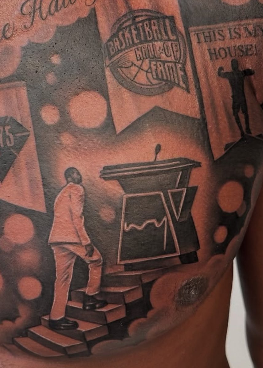 Dwyane Wade tattoos: close detail of the Hall of Fame, basketball, and staircase tattoo elements