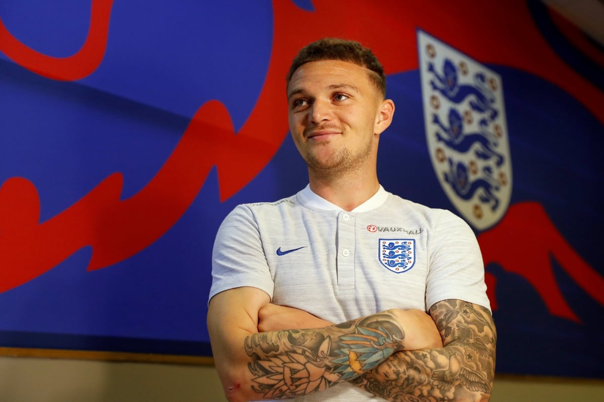 Kieran Trippier tattoos: Kieran Trippier crossed-arm view of the floral and illustrative sleeve tattoos