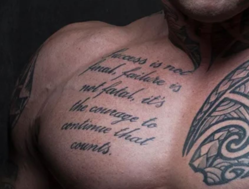 Martyn Ford right chest script tattoo