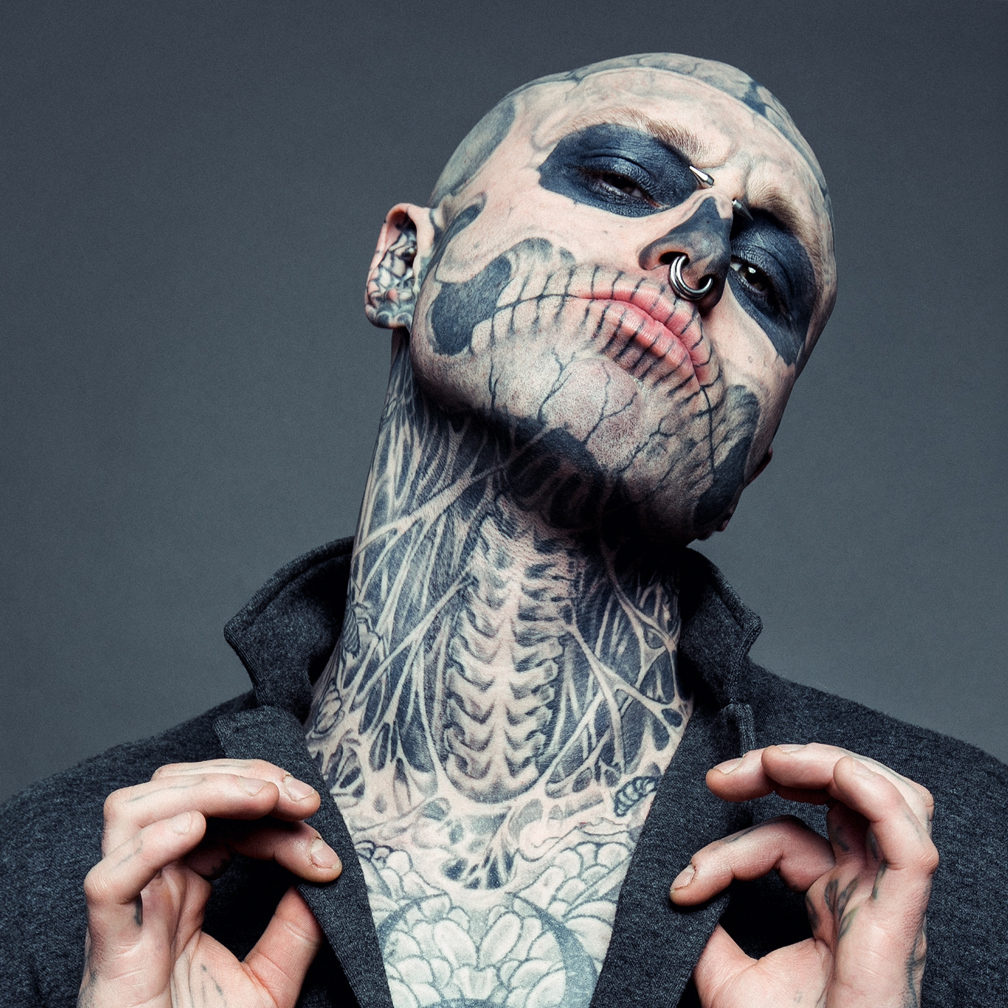 Rick Genest tattoos: sharp front portrait showing the jaw, neck, chest ribcage, insects and central body tattoo work