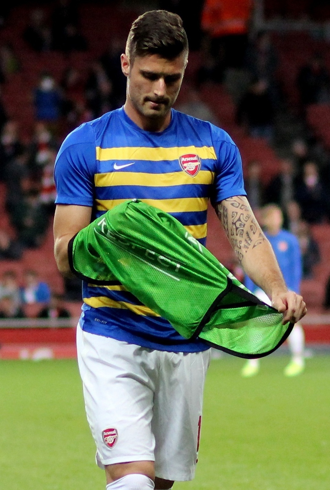 Olivier Giroud tattoos: Olivier Giroud older match photograph with the tattooed arm visible