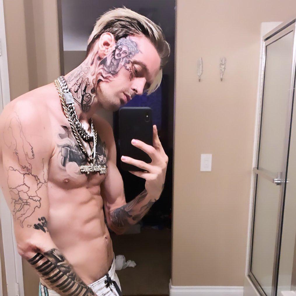 Aaron Carter face neck and arm tattoos