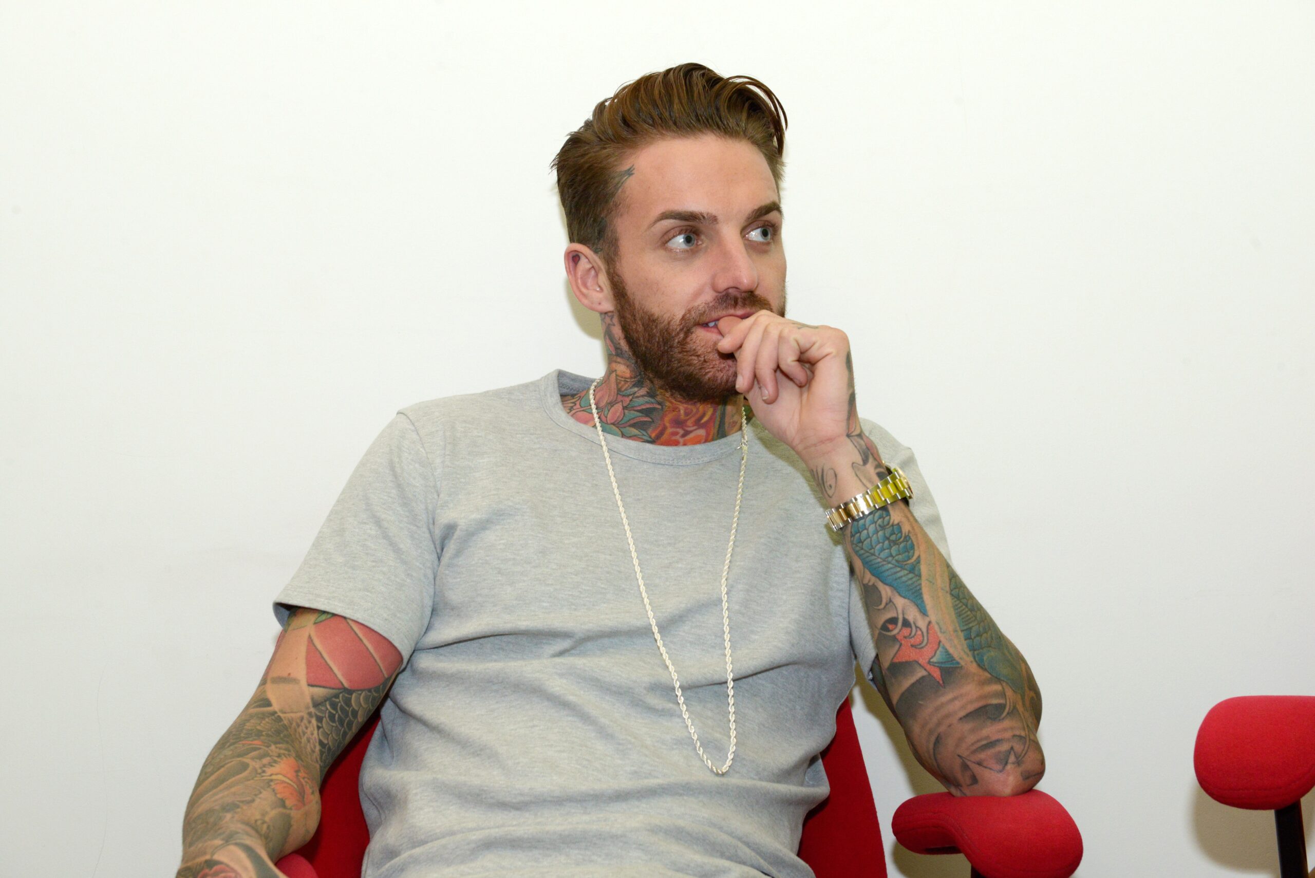 Aaron Chalmers tattoos: Aaron Chalmers's visible neck, forearm and hand tattoos in a Digital Spy portrait